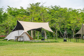 Camping tents on green grass in the park