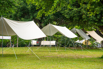 Camping tents on green grass in the park