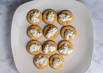 golden crackers top with  cream cheese