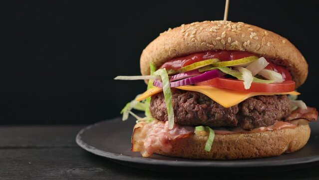 fresh tasty burger on black plate