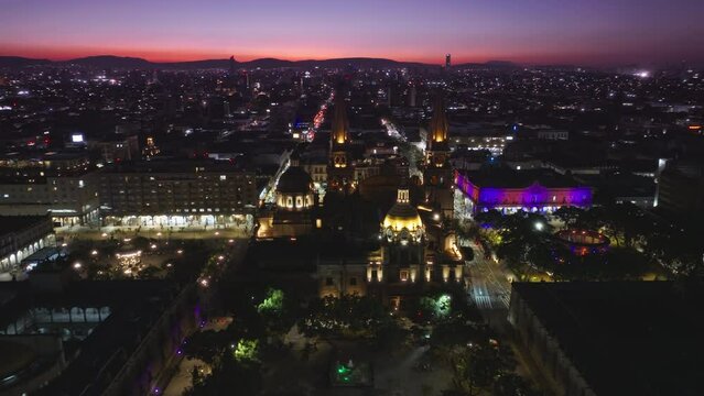 Pink sunset overhead view of central plaza of Guadalajara Mexico, drone flying above historic architecture Cathedral. Aerial view of Guadalajara Cathedral and Plaza Guadalajara in Jalisco, Mexico 4K