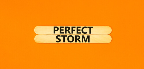 Perfect storm symbol. Concept words Perfect storm on beautiful wooden stick. Beautiful orange table...