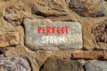 Perfect storm symbol. Concept words Perfect storm on beautiful big grey stone. Beautiful stone wall...
