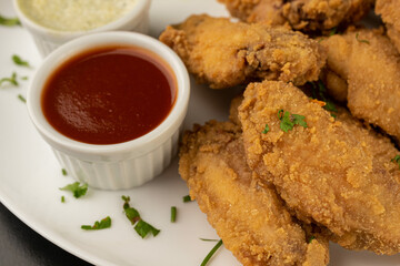 Petisco - Chicken wing seasoned and breaded with sour cream and spicy sauce
