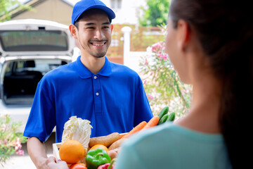 Parcel delivery staff deliver products to customers at their doorsteps.