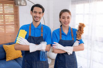 Male and female staff cleaning customers' homes.
