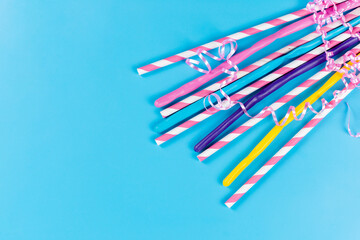 a top view colorful straws long sticky isolated on the blue background drink juice cold color