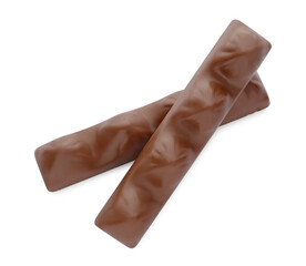 Sweet tasty chocolate bars on white background, top view