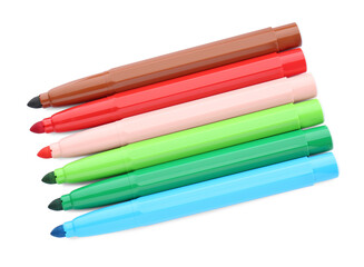 Many different colorful markers on white background, top view
