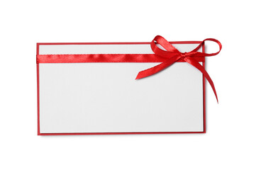 Blank gift card with red bow isolated on white, top view