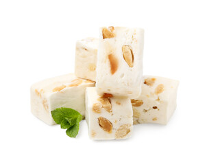 Pieces of delicious nougat and mint on white background