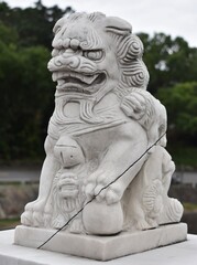 Fototapeta na wymiar Traditional stone guardian lion near a Chinese temple in Taiwan