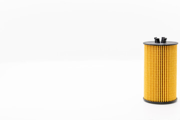 Oil filter isolated on white background service for car, replacement, selective focus copy space - obrazy, fototapety, plakaty