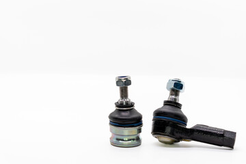 Tie rod end next to ball joint isolated on white background, auto parts, car service, selective focus, copy space