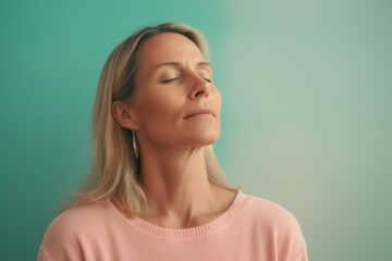 Medium shot portrait photography of a woman in her 40s practicing mindfulness, sophrology, relaxation & stress-reduction wearing a cozy sweater on pastel background. Generative AI