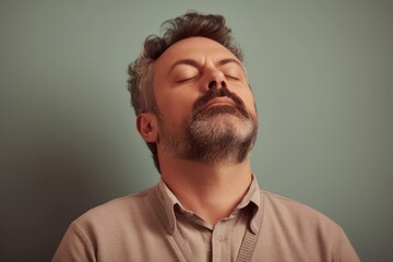 Obraz premium Portrait of a bearded man with closed eyes. Toned.