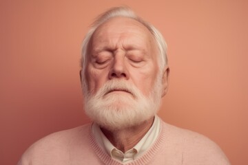 Portrait of an old man with a white beard and mustache on a pink background