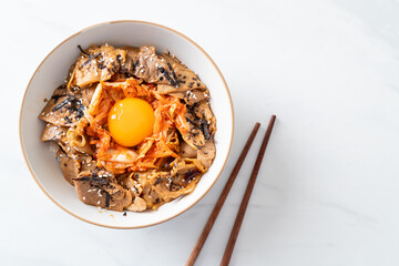 pork bulgogi rice bowl with kimchi and Korean pickled egg