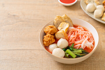 small flat rice noodles with fish balls and shrimp balls in pink soup, Yen Ta Four or Yen Ta Fo