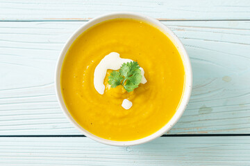 pumpkin soup in white bowl