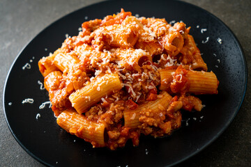 Rigatoni pasta bolognese with cheese