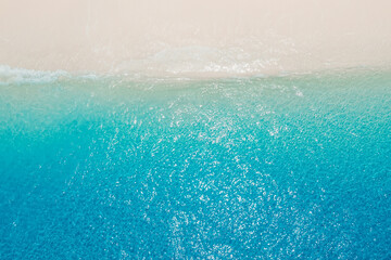 Obraz na płótnie Canvas Tropical beach and crystal blue ocean. Aerial view of holidays beach in Maldives