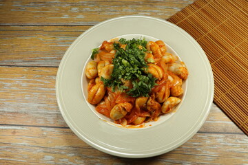 Traditional fried spicy squid egg with special Korean sauce serving on the plate. Famous appetizer menu in Asian restaurant.