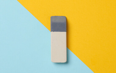 Eraser on a blue-yellow background
