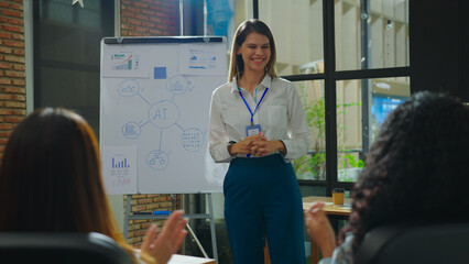 In the meeting room, the young and beautiful businesswoman confidently presented her project to the team, expertly explaining the data research behind it and impressing everyone with her insights.