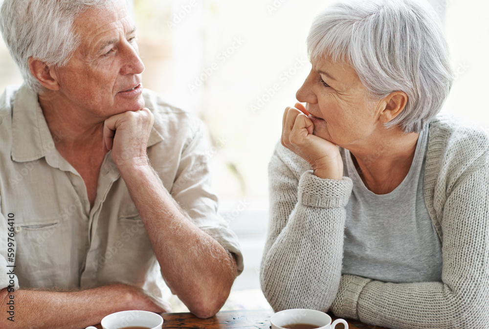 Sticker Senior couple, talking and drinking tea in home for conversation, communication and quality time together. Old man, elderly woman and chat with cup of coffee for break, retirement and romantic love