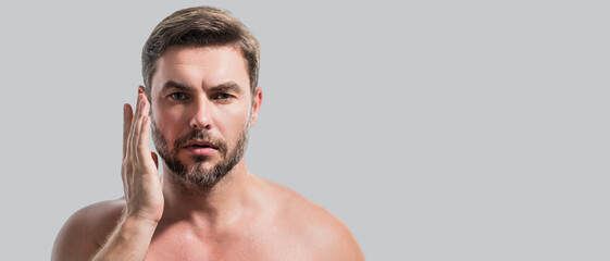 Close up portrait of man 40s having bristle isolated over gray background. Handsome man enjoy fresh perfect smooth skin. Beautiful man with perfect faces skin. Banner for header, copy space.