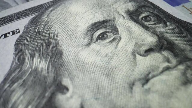 Benjamin Franklin S Face On One Hundred Dollar Notes Macro Shot. 100 USA Dollars Banknotes Symbol Of Rich Business Economy Of USA. American Dollars Cash Money Like Money Printing Process.