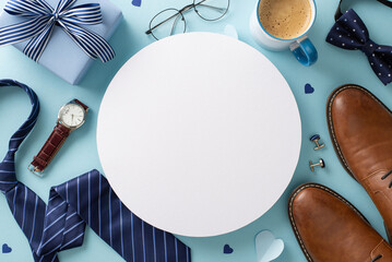 Hip Father's Day concept. Overhead view of necktie, bow-tie, wristwatch, glasses, cufflinks, giftbox, leather shoes, and coffee cup on pastel blue surface with empty circle for text