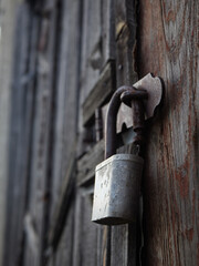 old rusty padlock, metal lock on a wooden door, rusty lock on an old door.