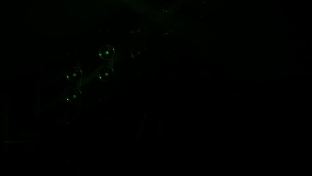 Moving spot lights catching erotic dancer in the dark, teasing with sexy moves of stretched legs and bright clothes. Sexy female stripper seducing client by erotic dance in private room of strip club