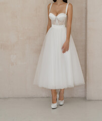 Gorgeous classic sleeveless wedding dress with cleavage. Bride dressed in the white wedding dress...