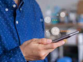 User sending ratings and reviews with 5-star online on smartphone. Customer review, feedback satisfaction survey concept. Customer services best excellent business rating experience. .