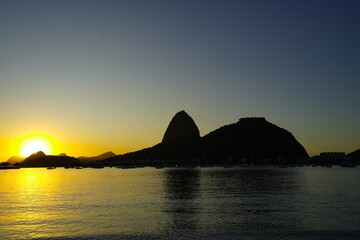 Golden Sunrise over Guanabara Bay in Rio de Janeiro with Sugarloaf Mountain in the Horizon