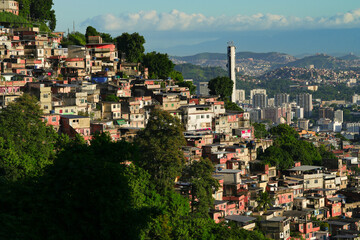 A colorful favela overlooking the Atlantic ocean in Rio de Janeiro. Beautiful sunrise view to...