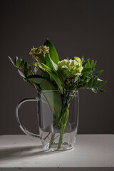 glass mug with green plants