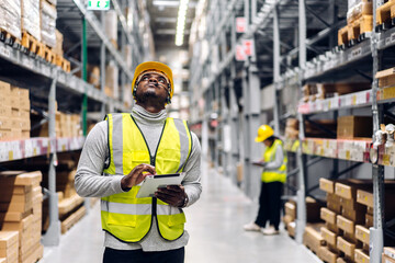 Portrait two african american engineer team shipping order detail export and import,industry 4.0,goods,factory,warehouse,international trade,transportation,cargo ship,logistic,distribution.industry