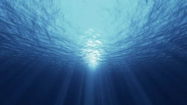 Underwater ocean waves deep blue ripple and flow with sun light rays. 4K seamless loop	