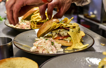 Chef working in busy kitchen preparing meals