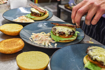 Chef working in busy kitchen preparing meals