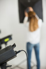 girl with a camera in the studio