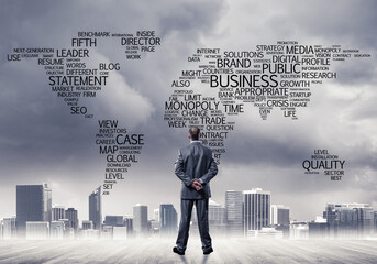 Motivation and inspiration concept with modern cityscape and businessman observing it
