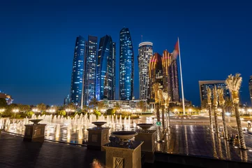 Photo sur Plexiglas Abu Dhabi Abu Dhabi, United Arab Emirates - April 5, 2021: Abu Dhabi downtown skyscrapers skyline named Etihad towers, representing wealth and development of the UAE capital city
