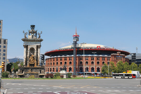 Fountain in Classical Style and Plaza de Toros de las Arenas Shopping Center in Espanya Square, Barcelona, Spain