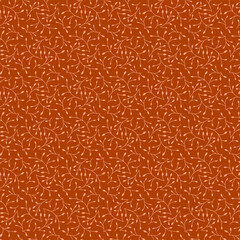 Small autumn leaves on an orange brown background Simple modest botanical fabric pattern Ditsy rustical style