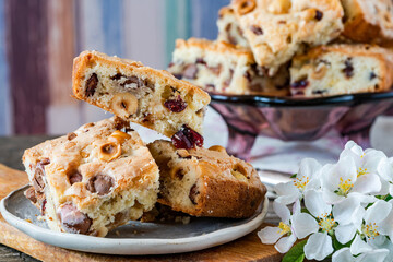 Easter mini chocolate egg traybake with hazelnuts and cranberries cut into squares